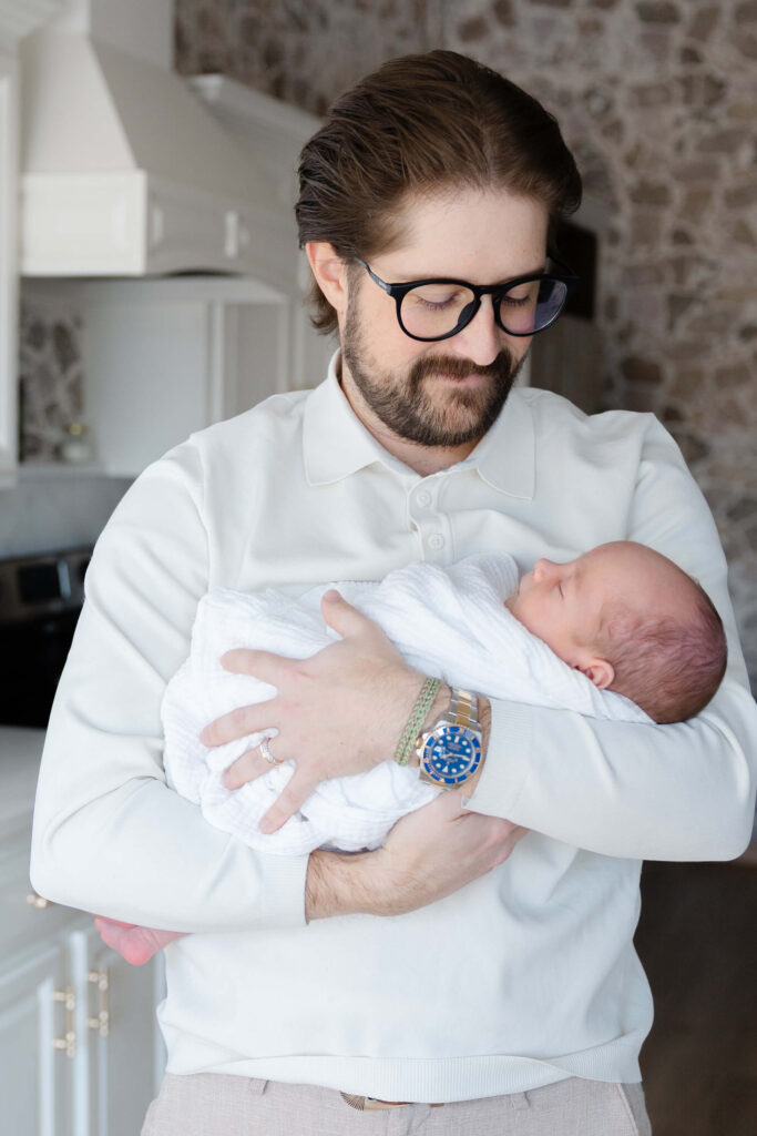 northern-colorado-newborn-dad-holding-baby.jpg