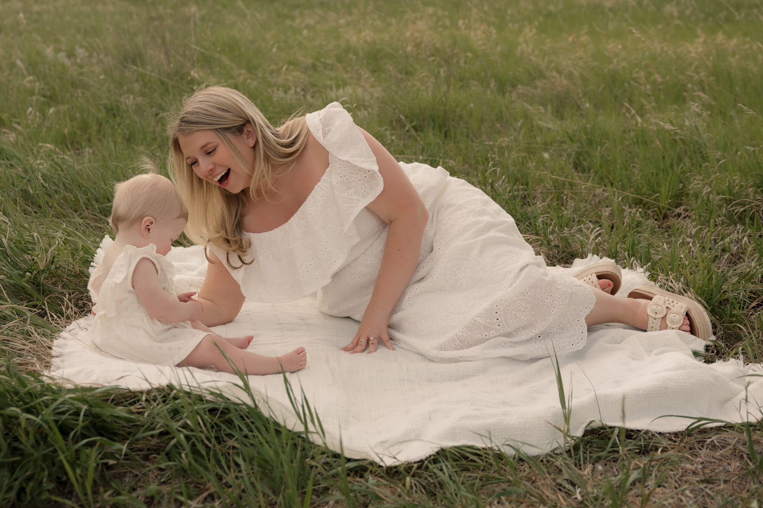 Mom smiling at her daughter during a natural family photography session at Lory State Park near Fort Collins.
